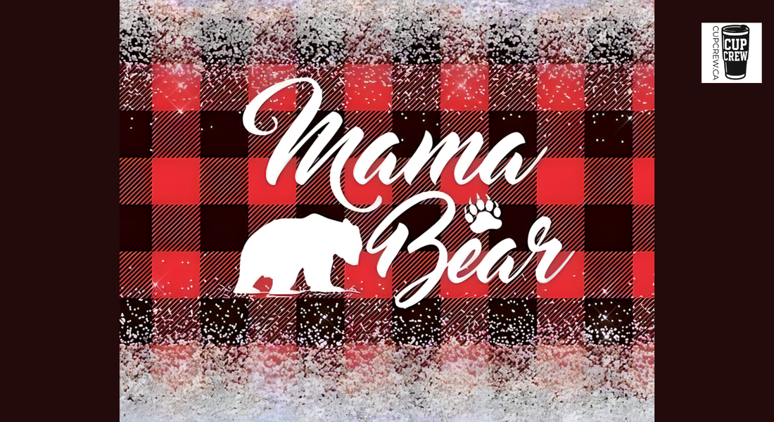 a graphic design with the text "Mama Bear" and a silhouette of a bear. The background has a red and black plaid pattern, and there are snowflakes scattered throughout the image.